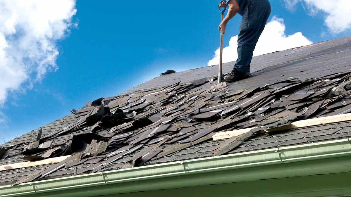 Signs That You Need a Roof Replacement - Working on roof top
