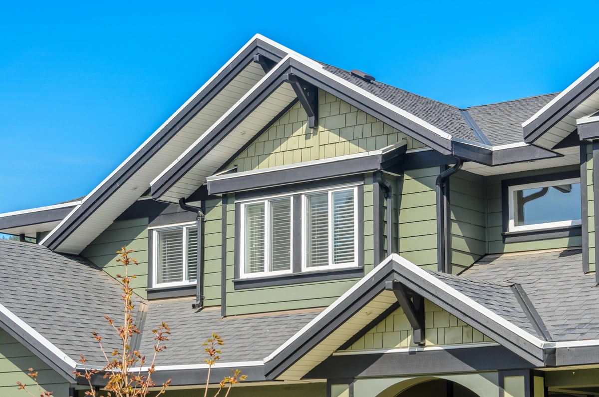 gable roof of house and green siding