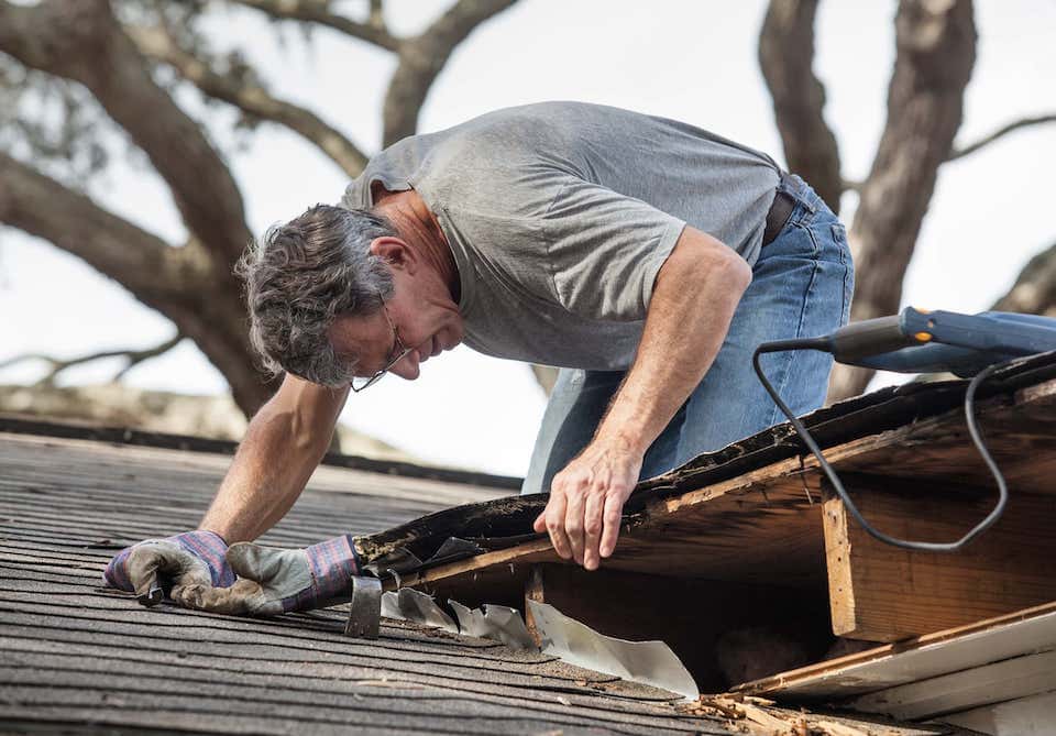 roof inspector looking at an old roof