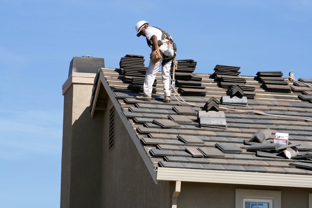roof technician standing on a roof