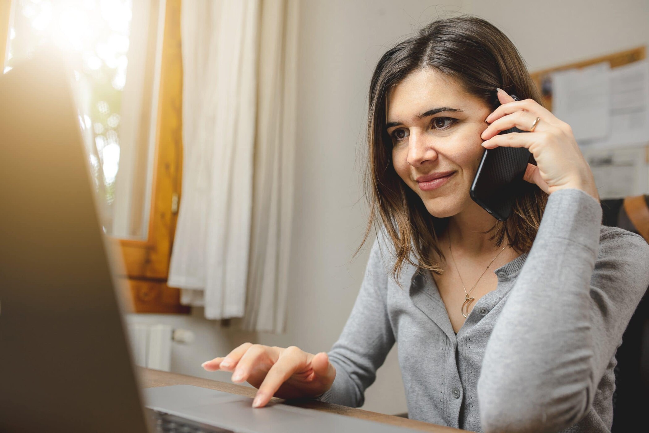 homeowner on the phone calling roofing contractor